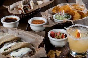 Selection of soft tacos, chips, and a margarita