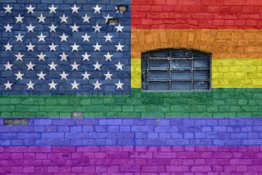 LGBTQ colored flag placed as wall graffiti