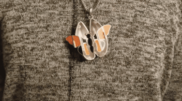 Jewelry Designer Emma shows off her custom designed pendant