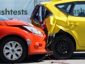 Red car collides with yellow vehicle